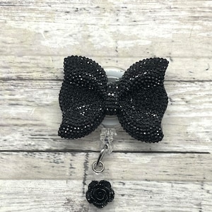 Bow name badge holder/badge reel
