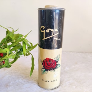 May include: Vintage Goya talcum powder tin with a black and white design featuring a black rose and the text "Goya Talc Black Rose".