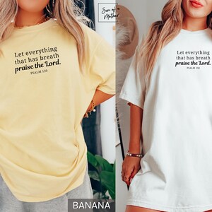 May include: Banana yellow and white t-shirts with the text "Let everything that has breath praise the Lord. Psalm 150" in black. The shirts are short-sleeved and have a relaxed fit.
