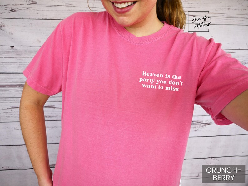 May include: Pink t-shirt with the text "Heaven is the party you don't want to miss" printed on the front. The shirt is made of a soft, comfortable material.