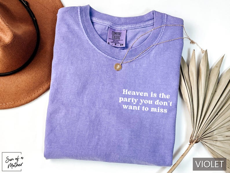 May include: A purple t-shirt with the text "Heaven is the party you don't want to miss" printed in white.