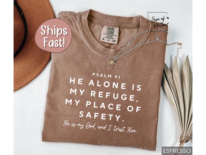 May include: A brown t-shirt with a white graphic that reads "PSALM 91 HE ALONE IS MY REFUGE, MY PLACE OF SAFETY. He is my God, and I trust Him."
