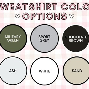 May include: Image displaying sweatshirt color options: Military Green, Sport Grey, Chocolate Brown, Ash, White, and Sand. The text "SWEATSHIRT COLOR OPTIONS" is at the top, with a pink and white checkered background.