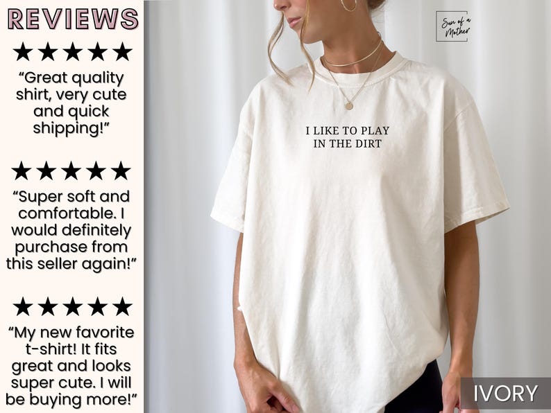 May include: A white t-shirt with the text "I like to play in the dirt" printed on the front. The shirt is shown on a model and the color is ivory.