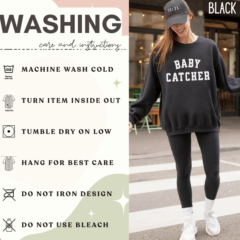May include: Black sweatshirt with the text "BABY CATCHER" in white. The sweatshirt is shown on a model wearing black leggings and a black baseball cap with the text "11:11" in white. The image also includes a list of washing instructions.