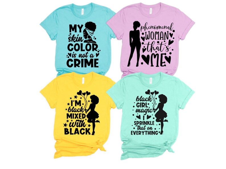 May include: Four t-shirts with different black and white graphic designs. The designs include the text "My skin color is not a crime", "Phenomenal woman that's me", "I'm black mixed with black", and "Black girl magic I sprinkle that on everything".