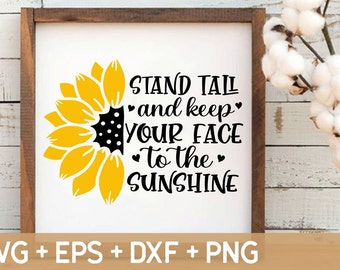 May include: A white sign with a black sunflower and the text "STAND TALL and keep YOUR FACE to the SUNSHINE".