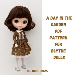 May include: A Blythe doll with brown hair and blue eyes wearing a brown floral dress with a white collar, lace trim, and white tights. The text reads: A DAY IN THE GARDEN PDF PATTERN FOR BLYTHE DOLLS BL 009 - 2025. The doll wears white shoes.