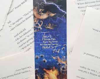 May include: A blue and gold bookmark with a phoenix design and the text "Tears Never Did Anyone Any Favours But Sometimes They Just Needed To Fall".