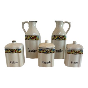 May include: Set of five vintage ceramic kitchen canisters with colorful floral designs and black lettering. The canisters are labeled "Epices", "Vinaigre", "Huile", "Muscade", and "Poivre".