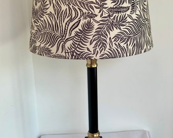 Vintage style black column table side lamp with gold accents and fern leaf design shade