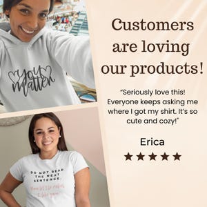 Op de afbeelding: De afbeelding toont twee personen die witte tops dragen. E&eacute;n top heeft de tekst "You Matter" in een hartvormig ontwerp, de andere luidt "Do Not Read The Next Sentence". De tekst "Customers are loving our products!" is ook zichtbaar.