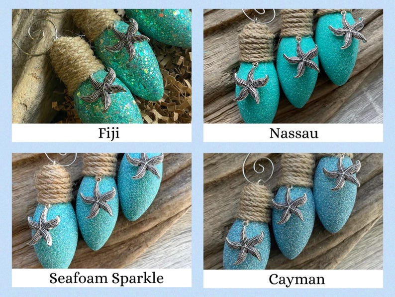 May include: Four teal blue lightbulb ornaments with a burlap bow and a silver starfish on each. The ornaments are labeled "Fiji", "Nassau", "Seafoam Sparkle", and "Cayman".