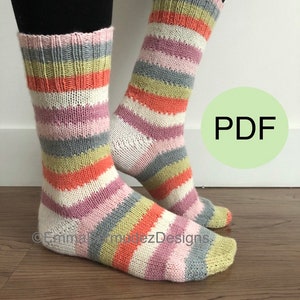May include: A pair of striped knit socks in shades of pink, orange, white, gray, and green. The socks are shown on a person's legs, with the PDF text visible in the background.