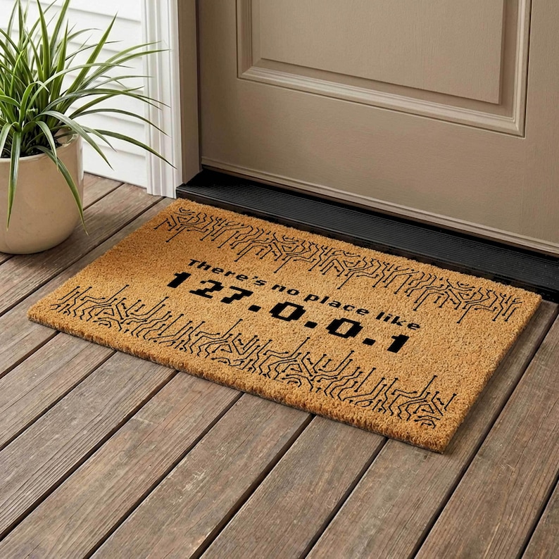 a door mat with a humorous message printed on it, placed on a wooden floor next to a door.