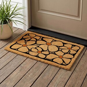 May include: A rustic wooden sign with the text "Welcome to our home" in white lettering. The sign features a distressed finish and a simple, inviting design, perfect for a front porch or entryway.