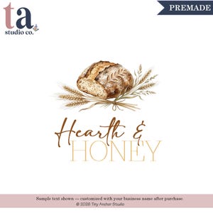 May include: A watercolor illustration of a round loaf of crusty bread resting on a bundle of wheat stalks. Below the illustration, the text reads Hearth & HONEY in a combination of brown script and gold serif lettering on a white background.