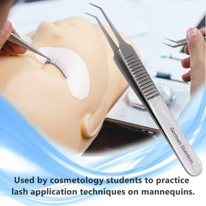 May include: A pair of silver tweezers with a textured handle. The tweezers are labeled "German Stainless". The tweezers are used for applying false eyelashes.