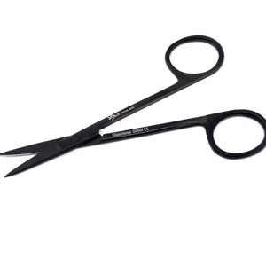 May include: Black surgical scissors with a stainless steel construction and a black handle. The scissors have a sharp point and are labeled "Stainless Steel CE".