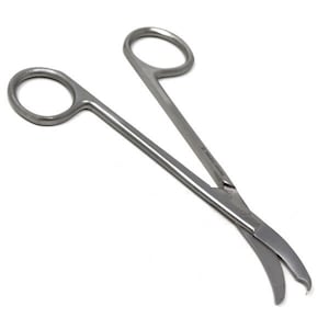 May include: A pair of stainless steel surgical scissors with curved blades. The scissors have a ring handle on one end and a straight handle on the other. The blades are sharp and pointed.