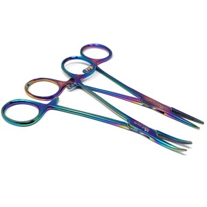 May include: Three rainbow-colored surgical clamps with a pointed tip. The clamps are made of stainless steel and have a rainbow finish.