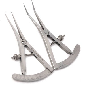 May include: Two silver calipers with a graduated scale on the curved arm. The calipers are made of German stainless steel.