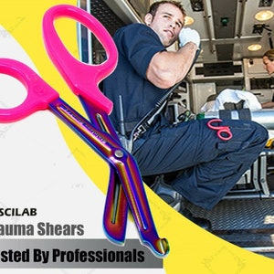 May include: Rainbow-colored trauma shears with pink handles. The shears are designed for emergency medical use and are trusted by professionals. The text "Trauma Shears" and "Trusted By Professionals" is visible in the image.