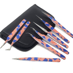 May include: A set of seven stainless steel tweezers with a patriotic red, white, and blue American flag design. The tweezers are in various shapes and sizes, and are displayed with a black zippered case.