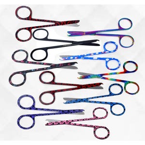 May include: A set of ten stainless steel grooming scissors with colorful paw print designs. The scissors have a variety of colors, including red, blue, purple, and black.