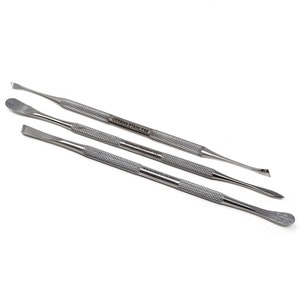 May include: Three stainless steel tools with different shaped tips. The tools are designed for cleaning and scraping. The tools are labeled "German Stainless".