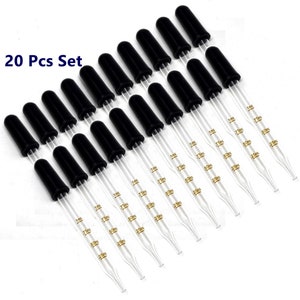 May include: A set of 20 clear glass droppers with black rubber bulbs. Each dropper is marked with measurements in milliliters: 1ml, 0.75ml, 0.5ml, 0.25ml.