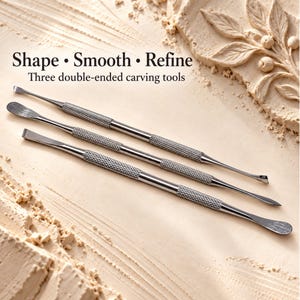 May include: Three silver-colored metal double-ended carving tools with textured knurled grips. The text "Shape • Smooth • Refine" and "Three double-ended carving tools" is printed above the tools, which feature various shaped tips.