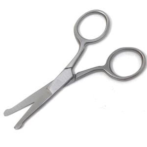 May include: Small, silver-colored scissors with rounded handles and short, blunt blades. The scissors are designed for precision cutting and are likely used for grooming or crafting. The blades are slightly open, showing the cutting edge.
