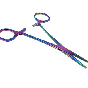 May include: Rainbow-colored surgical hemostatic forceps with a serrated jaw and a locking mechanism.