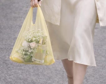 Shopper bag in lemon yellow. Tulle bag. Transparent bag. Shopping bag. Mesh bag. Convenient package. Useful bag. Sheer bag.