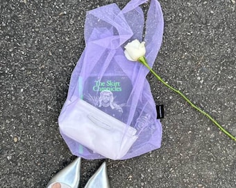 Shopper bag in pastel lilac purple. Tulle bag. Transparent bag. Shopping bag. Mesh bag. Convenient package. Useful bag. Sheer bag.