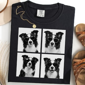 May include: Black t-shirt featuring a grid of four black and white images of a Border Collie wearing sunglasses. A gold necklace and brown sandals are also visible. The shirt is labeled XL-TG.