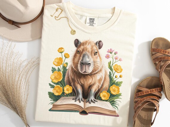 Capybara T Shirt, Cute Capybara Reading Book Shirt, Popular Rodent Lover Tee, Cozy Animal Tee, Bookish Pet Gift, Floral Wildlife Top