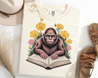 Bigfoot T Shirt, Funny Bigfoot Reading Shirt, Popular Sasquatch Book Tee, Cozy Cryptid Tee, Bookish Monster Gift, Forest Yeti Top