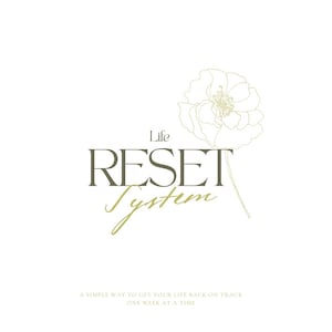 May include: White background with the words "Life RESET System" in a dark olive green font. A simple floral illustration is in the upper right corner. The text "A SIMPLE WAY TO GET YOUR LIFE BACK ON TRACK ONE WEEK AT A TIME" is at the bottom.