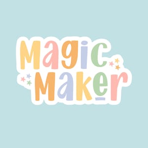 May include: A colorful sticker with the text "Magic Maker" in a rainbow of colors with stars on either side.