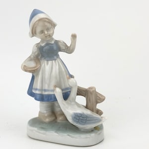 Girl figurine with geese or duck, feeding ducks german figurine from 20th century