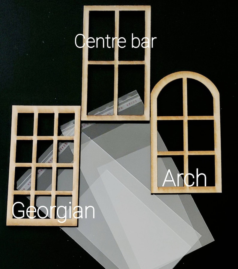 May include: Three light brown wooden window frames with clear plastic sheets. The frames are labeled Centre bar, Georgian, and Arch. The Georgian frame has twelve panes, the Centre bar has four panes, and the Arch frame has a rounded top with four panes.
