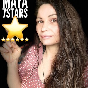 May include: A woman with long brown hair is smiling at the camera. She is wearing a pink and white polka dot dress. The text "YOUTUBE MAYA 7STARS" is visible in the top left corner of the image. A large gold star is visible in the centre of the image.