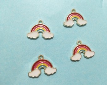 May include: Four gold-colored rainbow charms with white clouds. Each charm has a red, orange, yellow, green, blue, and purple rainbow with a gold outline.