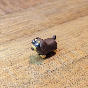 Hand-Sculpted Mini Dachshund Figurine: Polymer Clay Desk Pet