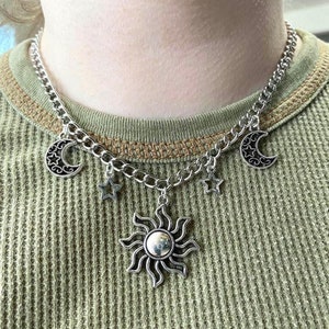 Silver tone celestial charm necklace