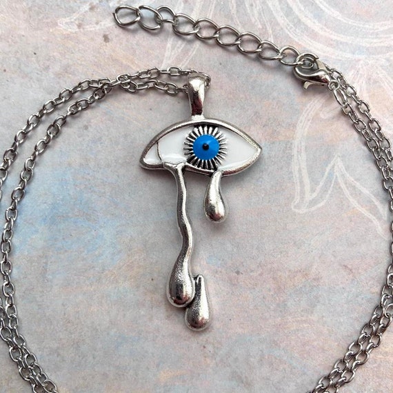 Crying eye best sale necklace