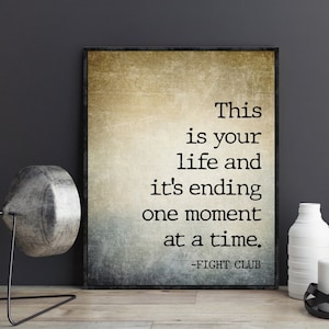 May include: A vintage-style poster with a quote from the movie Fight Club. The quote reads "This is your life and it's ending one moment at a time." The poster has a distressed, textured background.