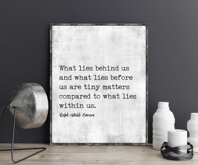 May include: Framed print with a textured, off-white background featuring a quote by Ralph Waldo Emerson: "What lies behind us and what lies before us are tiny matters compared to what lies within us."